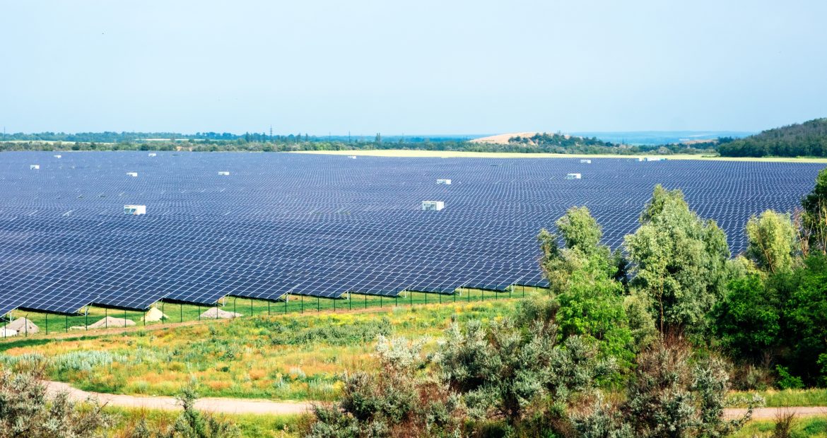 Panoramic view of photovoltaic power station, solar park, solar farm, solar power plant. Banner with modern solar farm