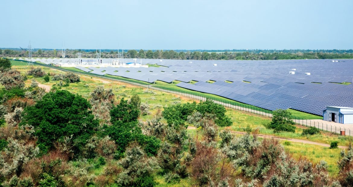 Panoramic view of photovoltaic power station, solar park, solar farm, solar power plant. Banner with modern solar farm